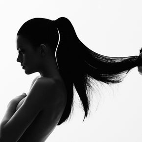 Model having her hair combed by Big Tease Comb